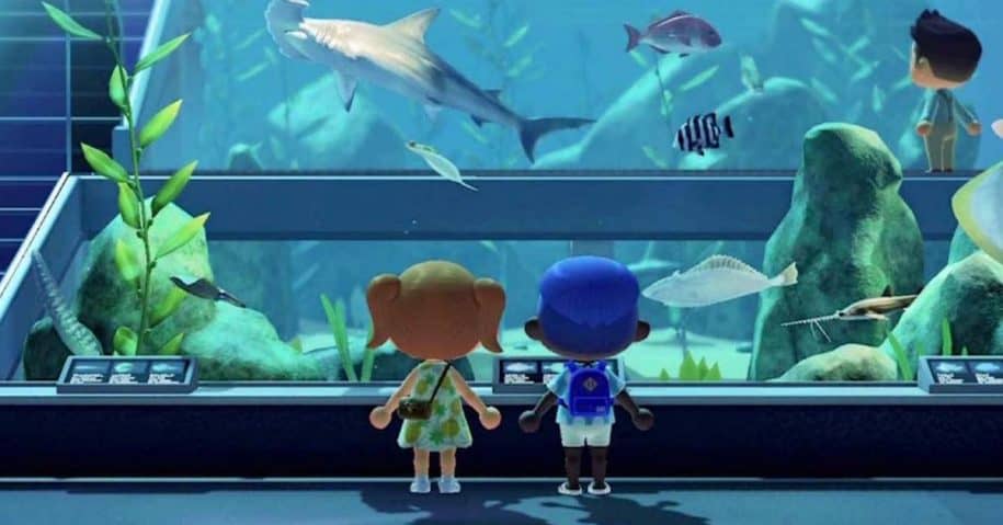 two virtual characters look at virtual aquarium